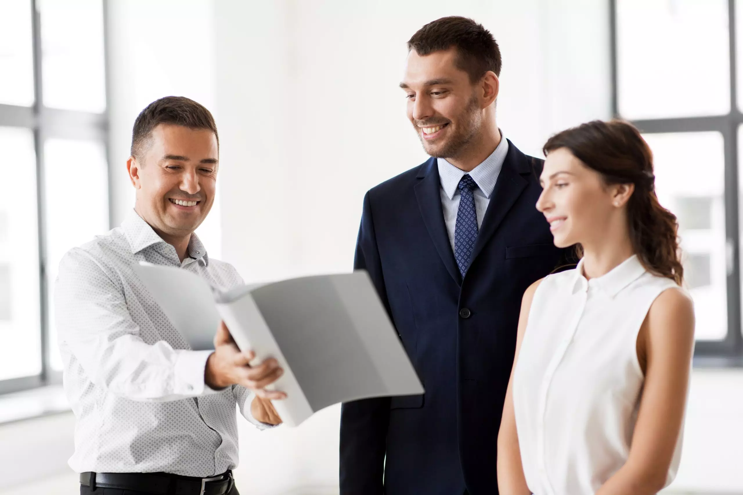 Realtor showing a couple a new home